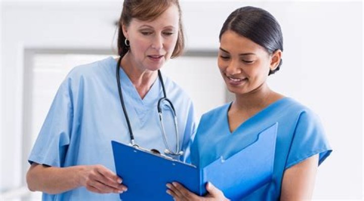 Can a registered nurse work as a nursing assistant?