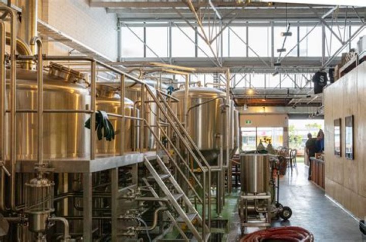 How do breweries distribute beer?