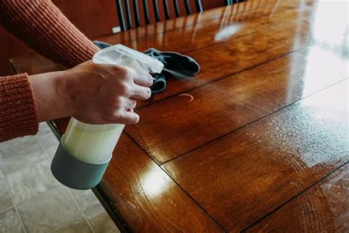How do you clean a wooden kitchen table daily?