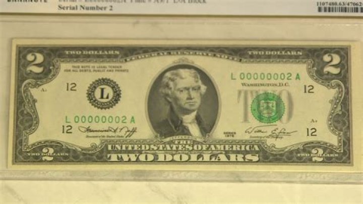 What does red ink on a 2 dollar bill mean?