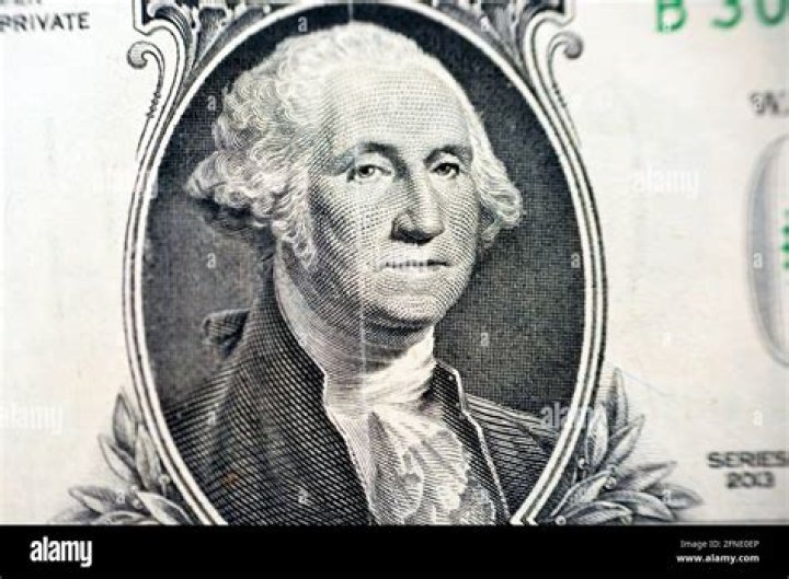 Which way is Washington facing on the dollar bill?