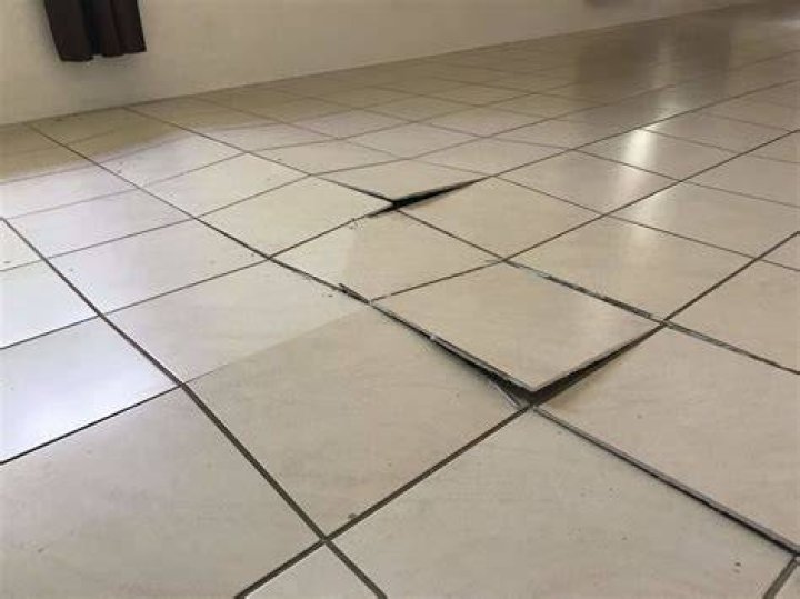 Why are floor tiles lifting?