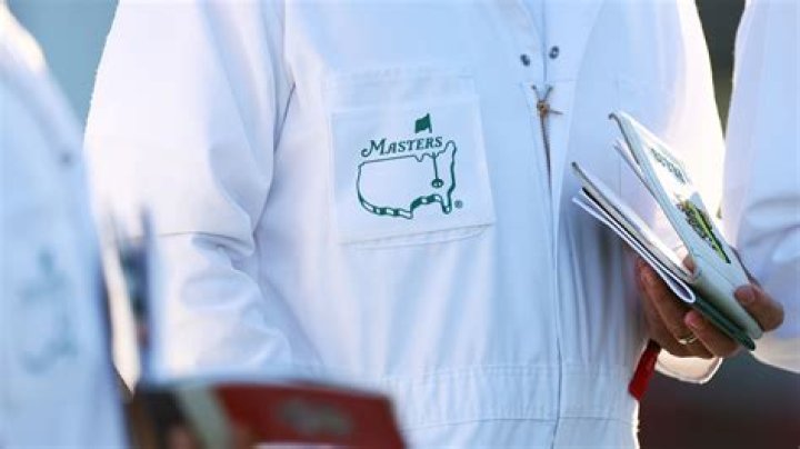 Why do Masters caddies wear white?